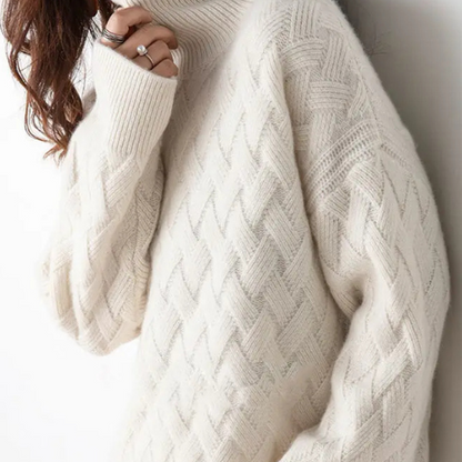 Stylish women's cascade turtleneck sweater with a distinct chevron pattern, ideal for elegant fall and winter outfits.