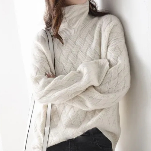 Relaxed fit women's elegant cascade turtleneck sweater. A cozy, warm pullover with a chic chevron pattern for winter.
