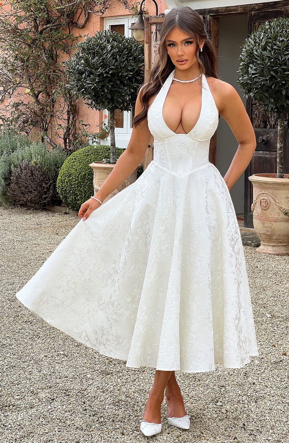 Chic women's halter midi dress with a corset bodice & A-line skirt, perfect for weddings & formal events.