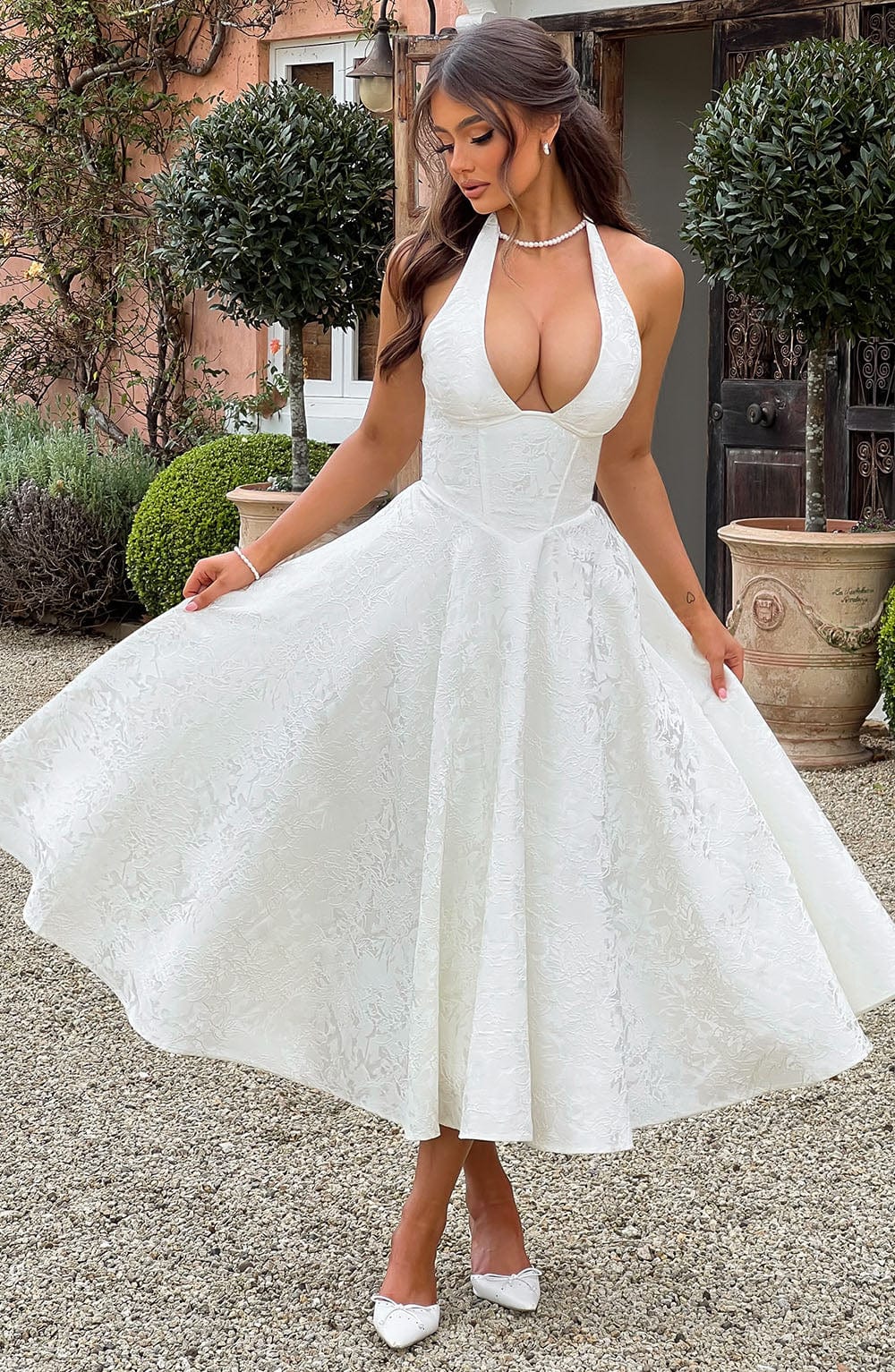Chic women's A-line midi dress with halter neckline & corset top, ideal for weddings and formal parties.