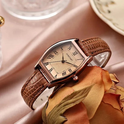 Timeless women's green wristwatch with Roman numerals, classic design. Adjustable & chic accessory.