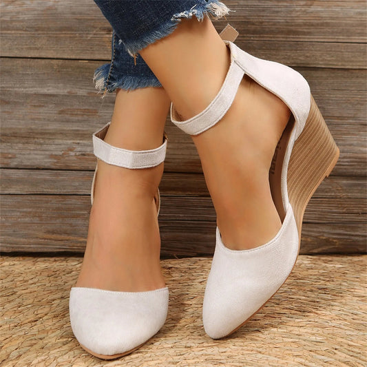Elegant women's closed-toe wedge heels with a comfortable ankle strap. Perfect for dressy occasions.