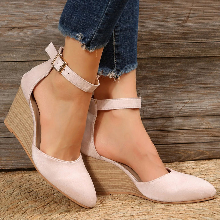 Comfortable closed-toe wedge heels for women, featuring a cushioned insole and elegant ankle strap.