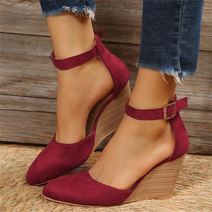 Beige women's elegant closed-toe wedge heels. Comfortable ankle strap & cushioned insole. Versatile footwear.