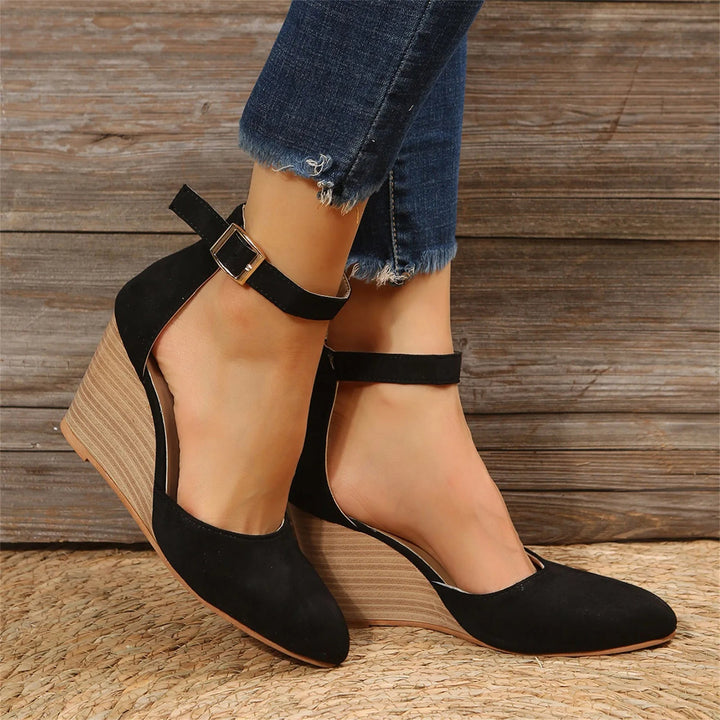 Brown women's fashion closed-toe wedge heels with an ankle strap, offering comfort and style for any event.