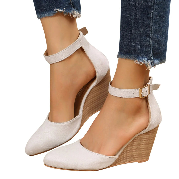 Women's elegant closed-toe wedge heels, featuring a cushioned insole, ankle strap for comfort & style.