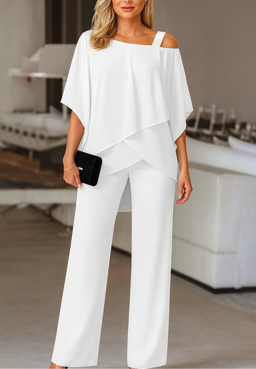Women's elegant cold-shoulder two-piece pants set in white. Versatile fashion for a sophisticated look.