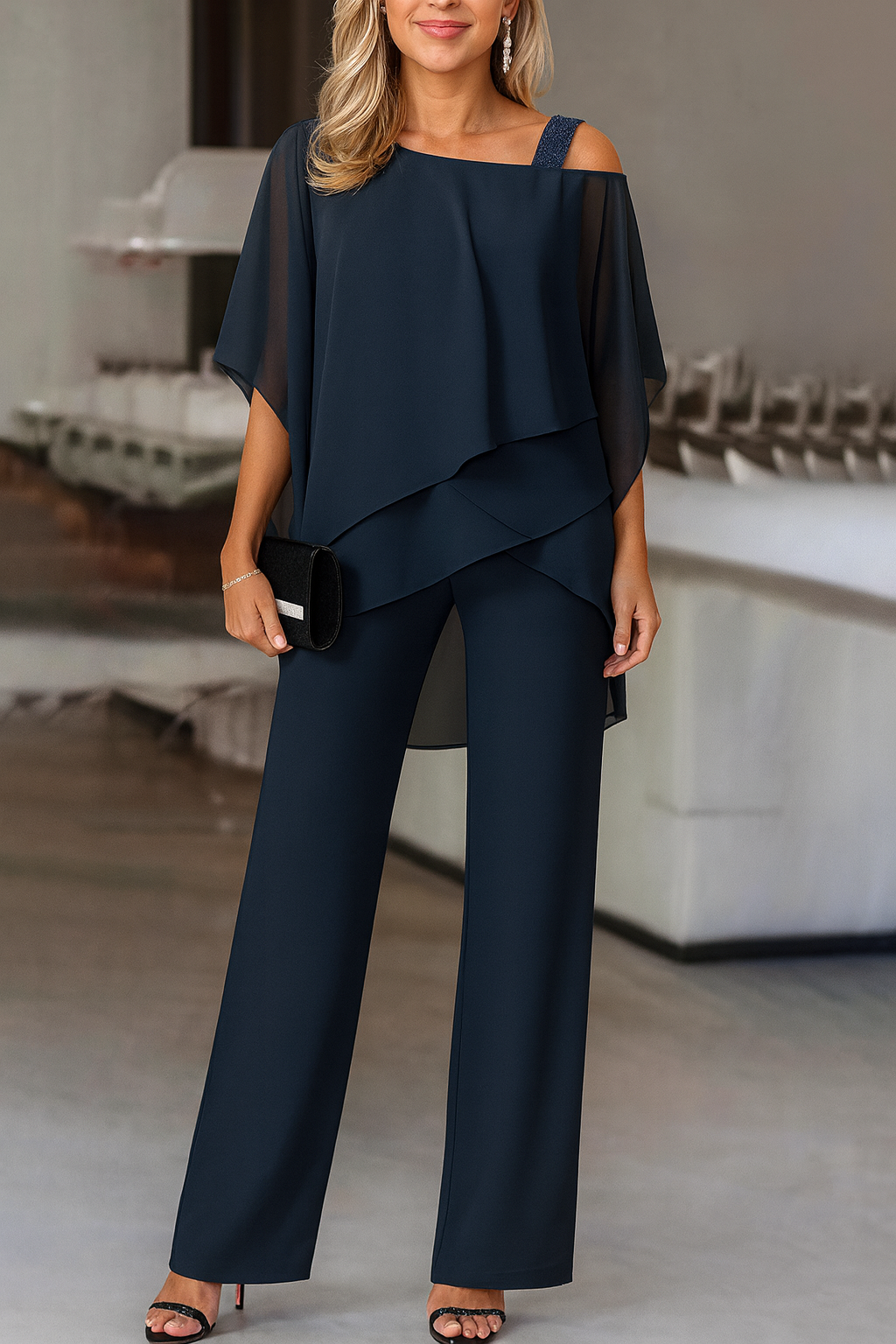 Fashionable women's two-piece cold-shoulder pants set. Designed for a chic and stylish appearance.