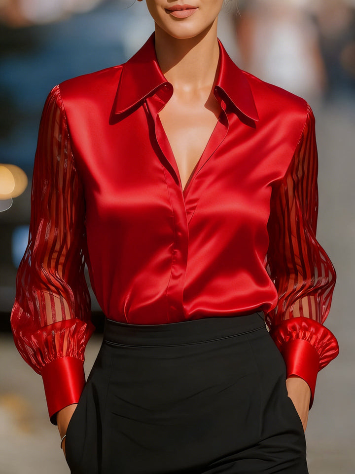 Versatile women's elegant collared shirt with long patterned sleeves, ideal for professional or business casual looks.