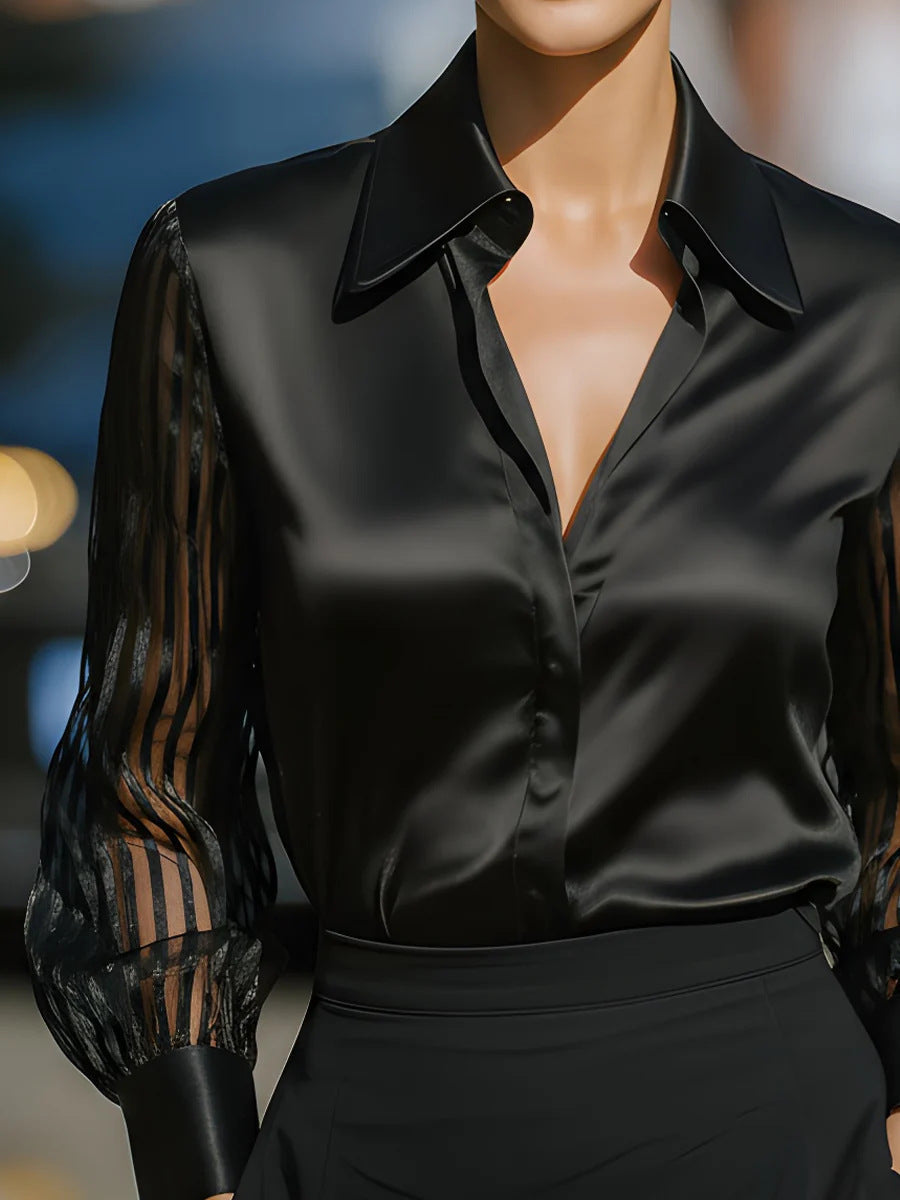 Women's elegant collared button-up blouse with patterned long sleeves, suitable for business casual fashion.