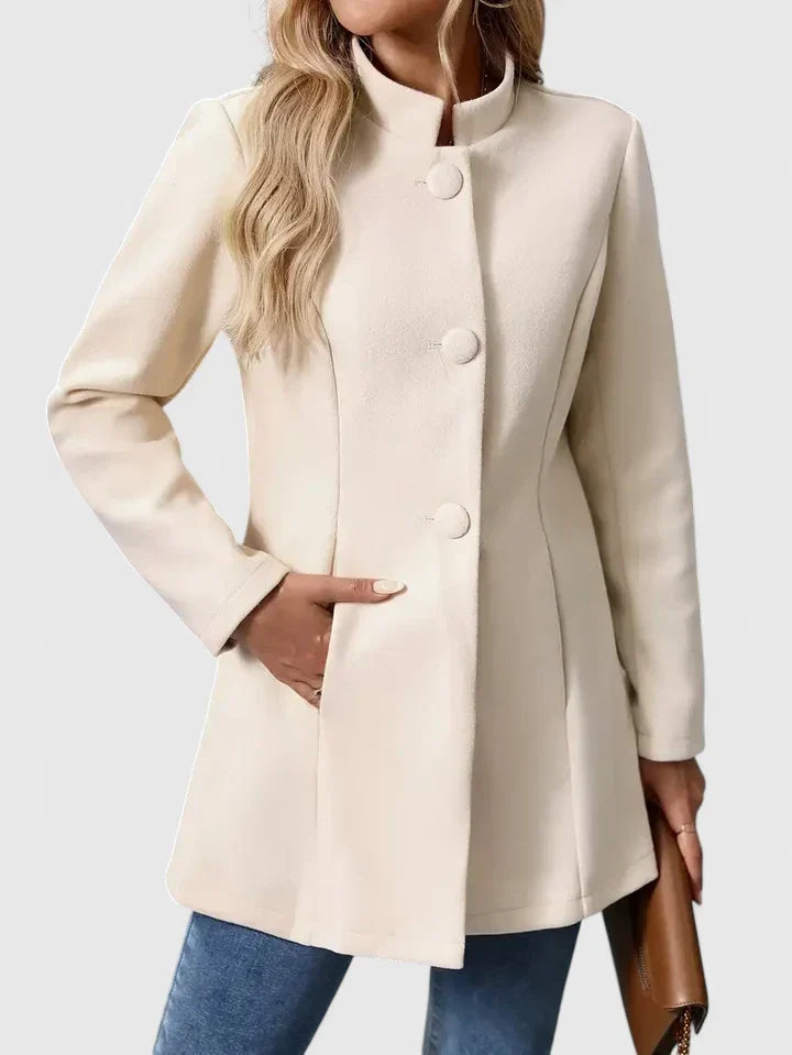Cream women's collarless jacket with button front. Sophisticated & versatile for modern workwear outfits.