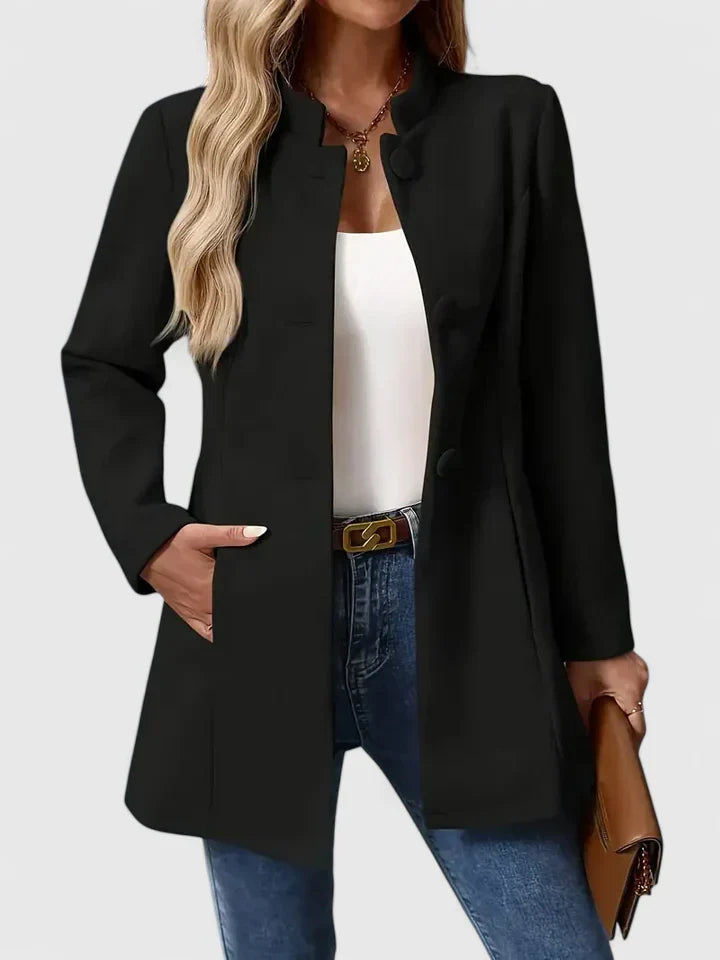 Versatile black women's collarless jacket. Chic, modern style with button front for elegant outerwear.