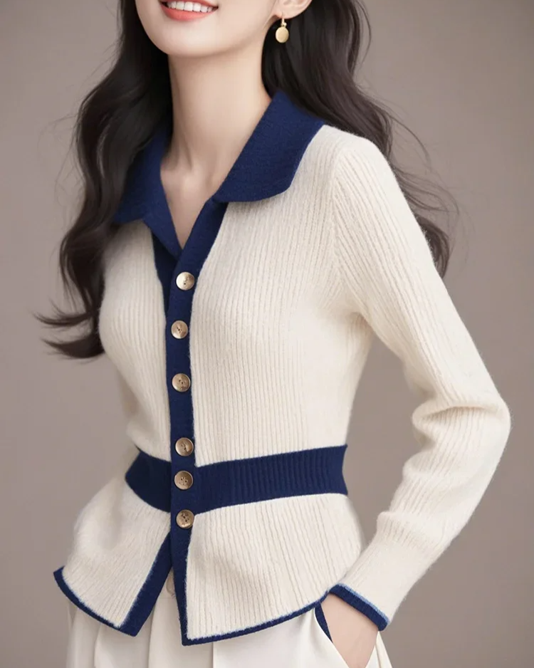 Close-up of a women's elegant cardigan showing the chic contrast design and soft fabric texture.