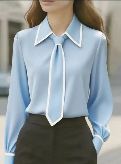 Chic versatile women's blouse with contrast tie, long sleeves, and a flattering, comfortable fit.