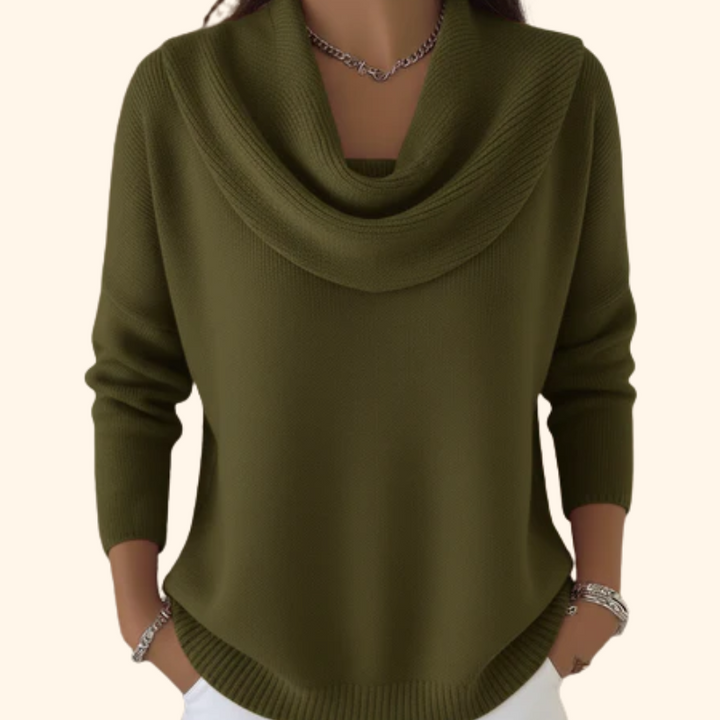 Stylish women's cowl neck sweater with a modern hi-lo hem. Versatile long-sleeve top for elegant casual or office wear.