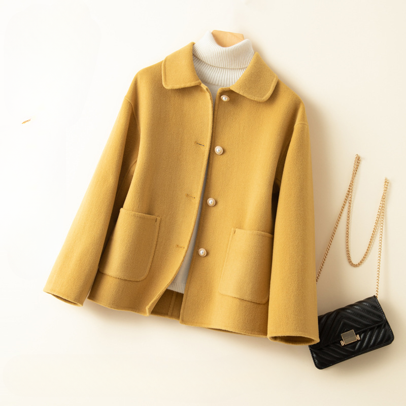 Chic women's cropped jacket, an elegant fall and winter outerwear piece with a stylish doll collar.