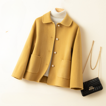 Chic women's cropped jacket, an elegant fall and winter outerwear piece with a stylish doll collar.