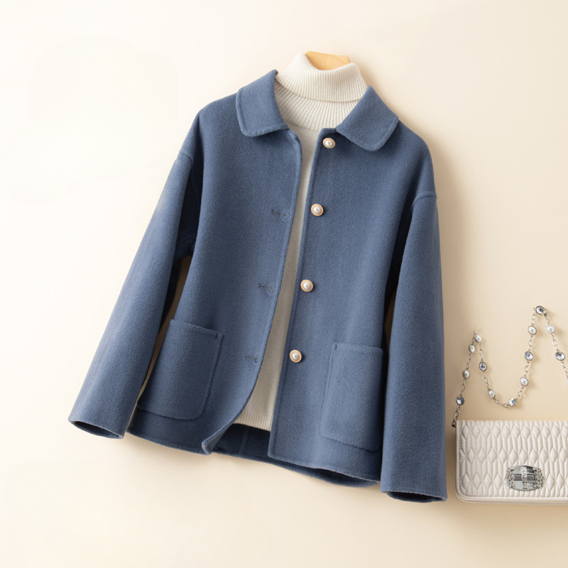 Stylish women's cropped outerwear, an elegant fall fashion jacket with a unique doll collar design.