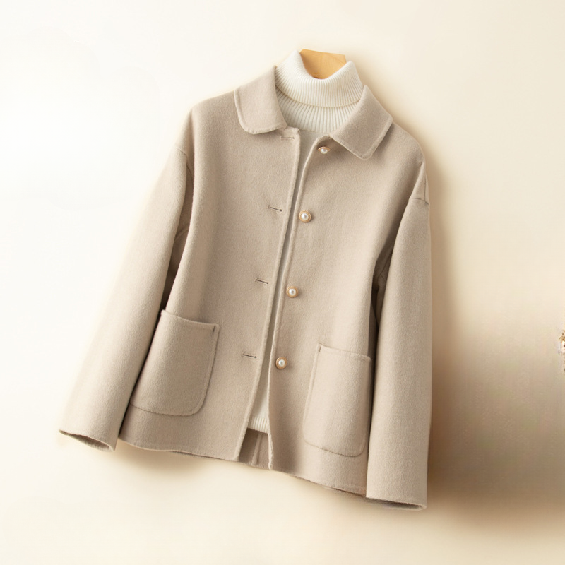 Women's elegant cropped coat with a doll collar. A classic, chic fall/winter jacket for sophisticated style.