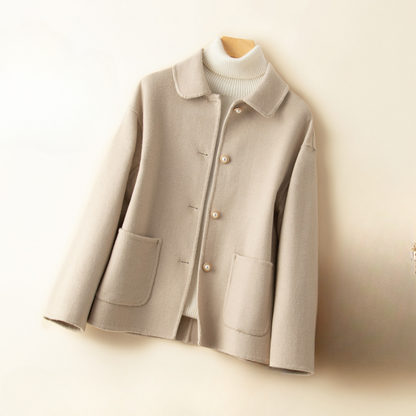 Women's elegant cropped coat with a doll collar. A classic, chic fall/winter jacket for sophisticated style.