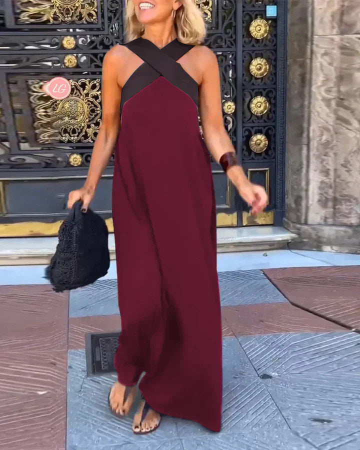 Long women's flowy maxi dress, featuring an elegant cross neck. A comfortable and fashionable casual evening dress.