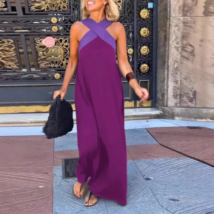 Stylish women's cross neck dress with a beautiful flowy maxi length. Perfect elegant summer evening wear.