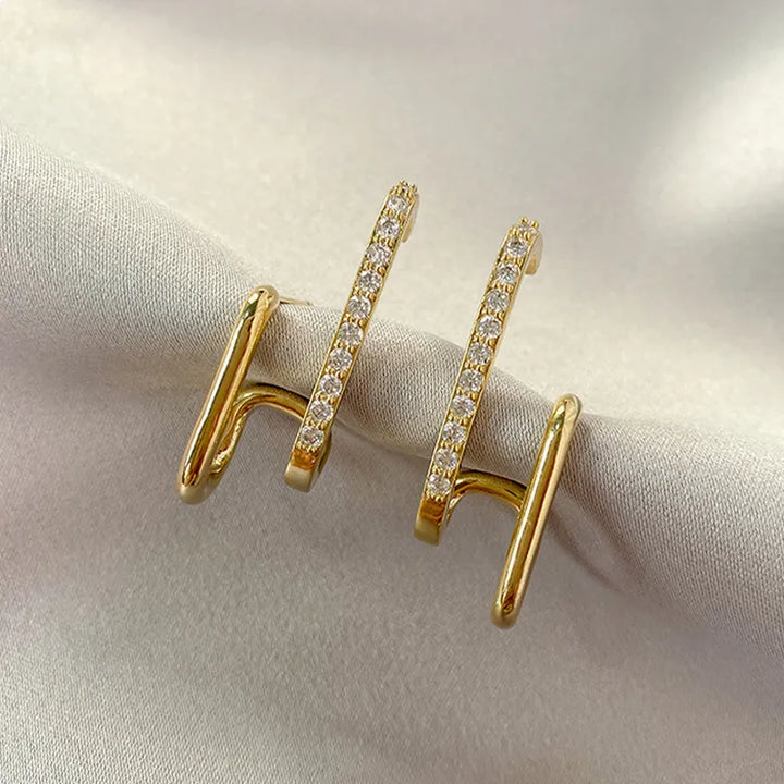 Elegant Women's Crystal Claw Stud Earrings. Sparkly, hypoallergenic gold-plated jewelry for everyday or special occasions.