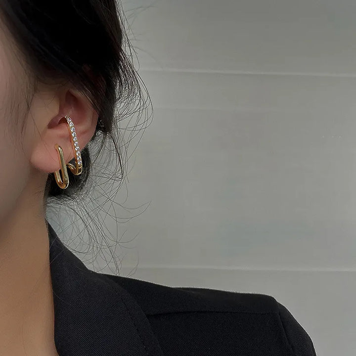 Woman wearing elegant Crystal Claw Stud Earrings. Perfect for special occasions or adding sparkle to everyday fashion.