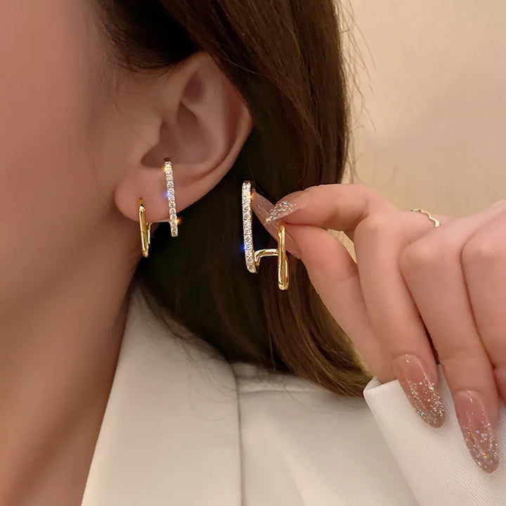 Brilliant Crystal Claw Stud Earrings. Elegant, hypoallergenic women's jewelry with sparkling crystals & polished metal finish.