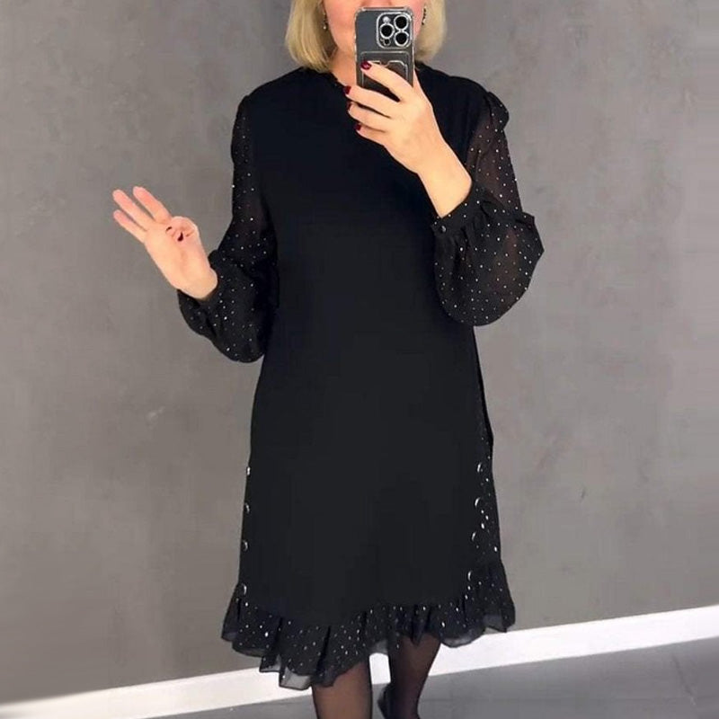 Glamorous women's party dress featuring sparkling crystals & a classic round neck for festive occasions.