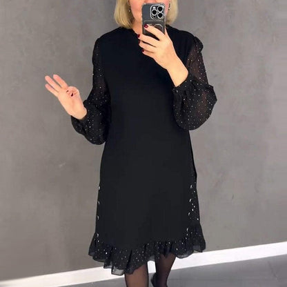 Glamorous women's party dress featuring sparkling crystals & a classic round neck for festive occasions.