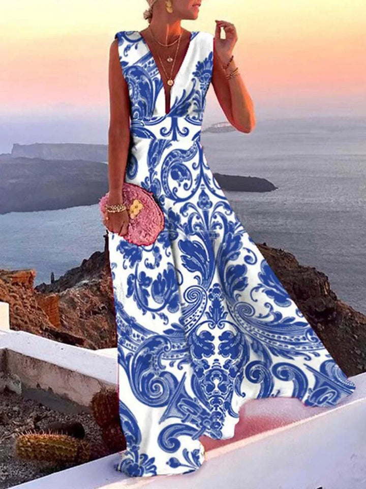 Graceful green flowy deep V-neck maxi dress for women, elegant sleeveless design for summer or formal wear.