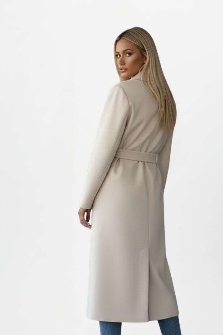 Chic women's double-breasted long coat with belt, essential stylish outerwear for fall and winter fashion.