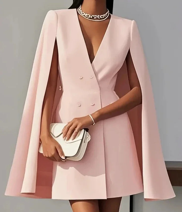 Sleek tailored women's mini dress, double-breasted with flowing cape sleeves, a chic choice for formal events.