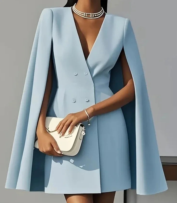 Stylish women's double-breasted cape sleeve mini dress, showcasing its flattering fit for sophisticated evening wear.