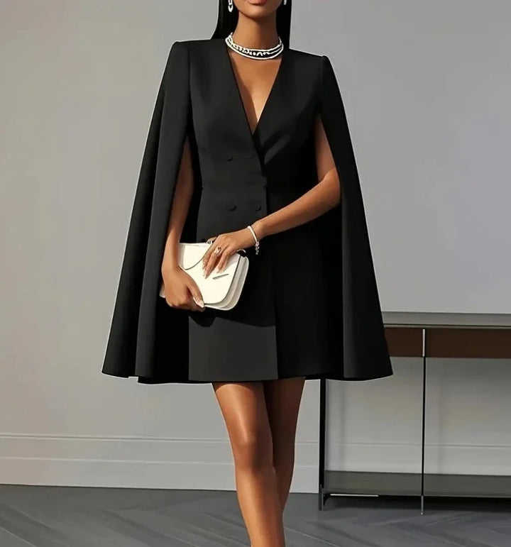 Modern women's double-breasted mini dress with unique cape sleeves, a fashion-forward choice for any formal occasion.