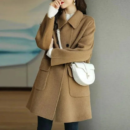Classic women's long structured double-breasted coat, a chic and elegant outerwear piece for cold weather.