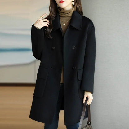 Sophisticated tailored women's double-breasted coat, an elegant structured jacket ideal for autumn/winter style.