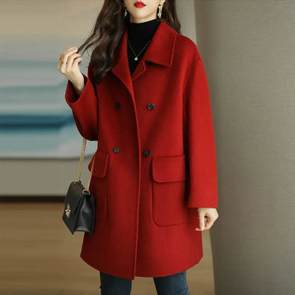Fashionable women's structured double-breasted long coat, offering an elegant and sophisticated tailored winter look.