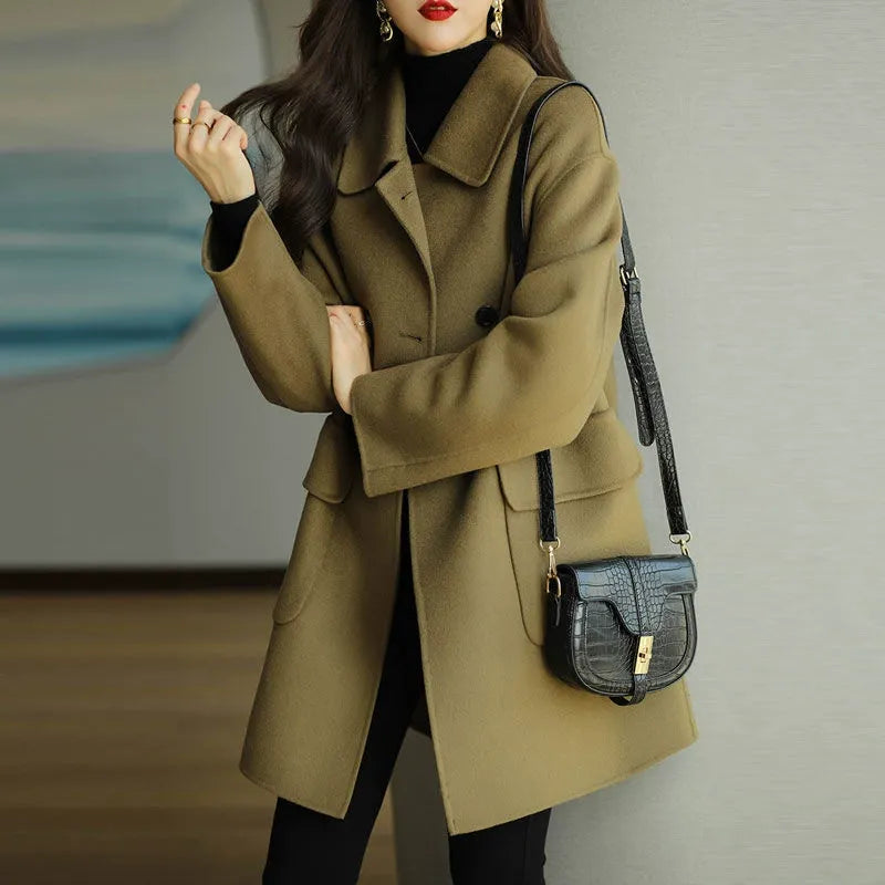 Elegant women's double-breasted coat, a structured long jacket delivering classic fashion and chic winter style.