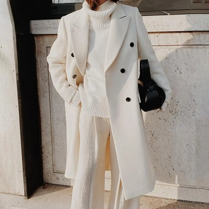 Classic women's double-breasted trench coat with a sophisticated notch collar, embodying professional style.