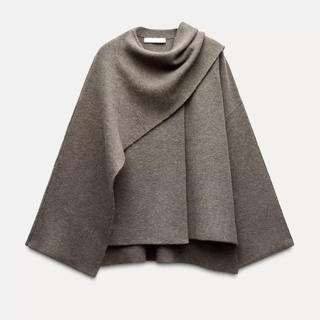 Stylish women's drape cape coat, flowing design. Versatile asymmetrical outerwear, perfect for chic fall & winter layering.