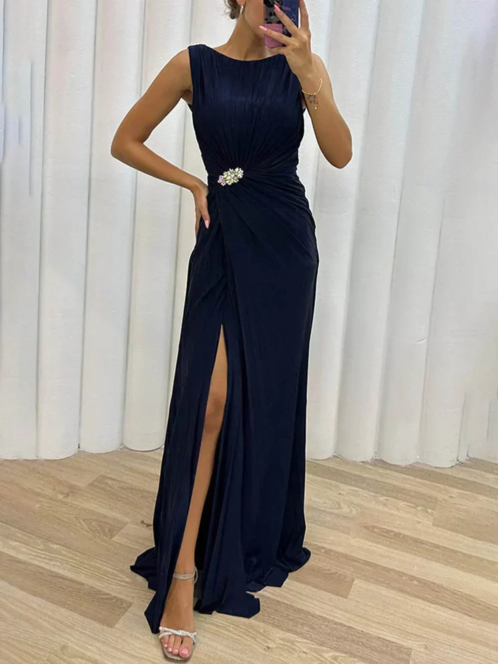 Stunning women's draped maxi gown, ideal for wedding guests. Features elegant high slit and jeweled waist.