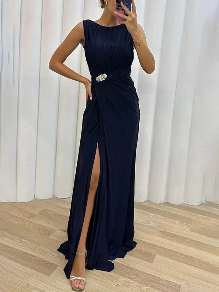 Stunning women's draped maxi gown, ideal for wedding guests. Features elegant high slit and jeweled waist.