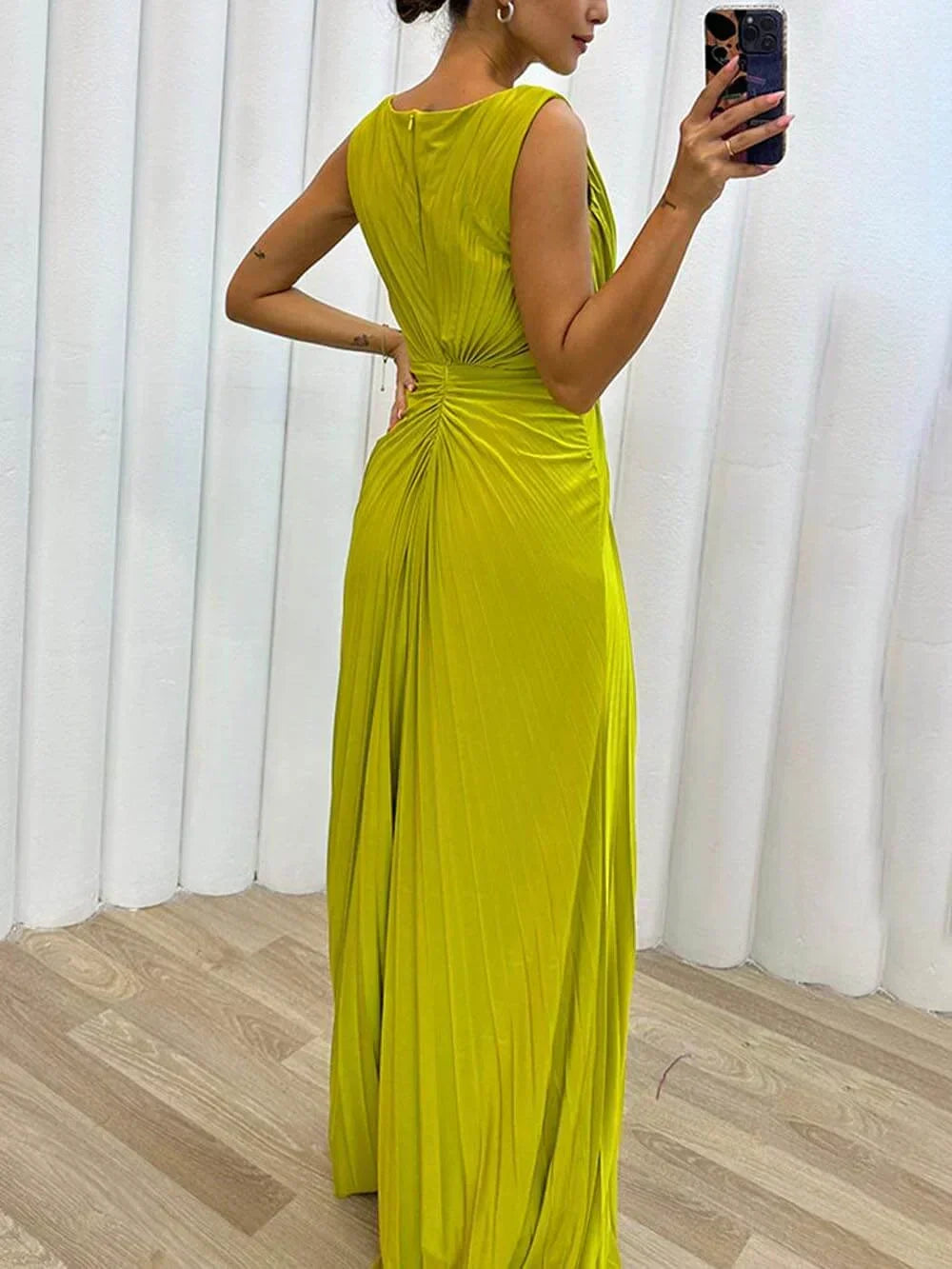 Fashionable women's party dress: an elegant draped maxi gown with a high slit & jeweled waist for statement style.