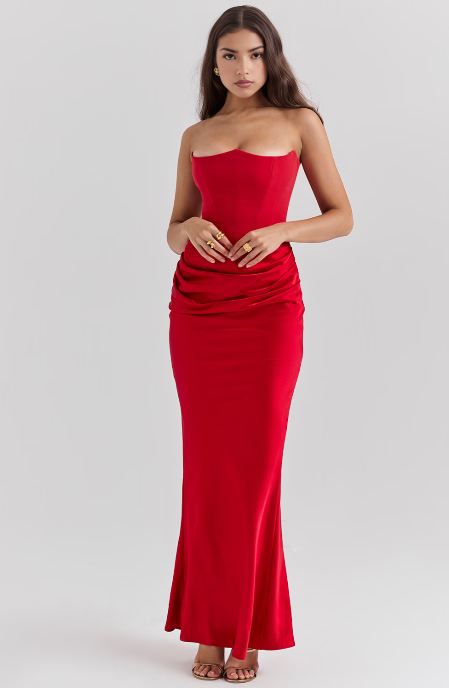 Stylish formal strapless prom dress, featuring a draped column silhouette.
