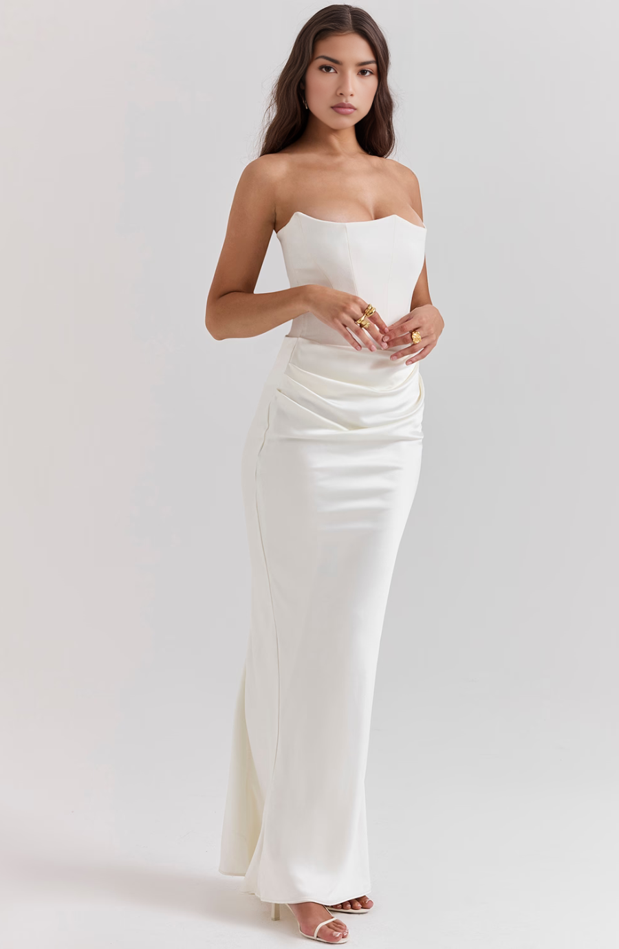 Glamorous women's strapless formal gown, with chic draped detailing.