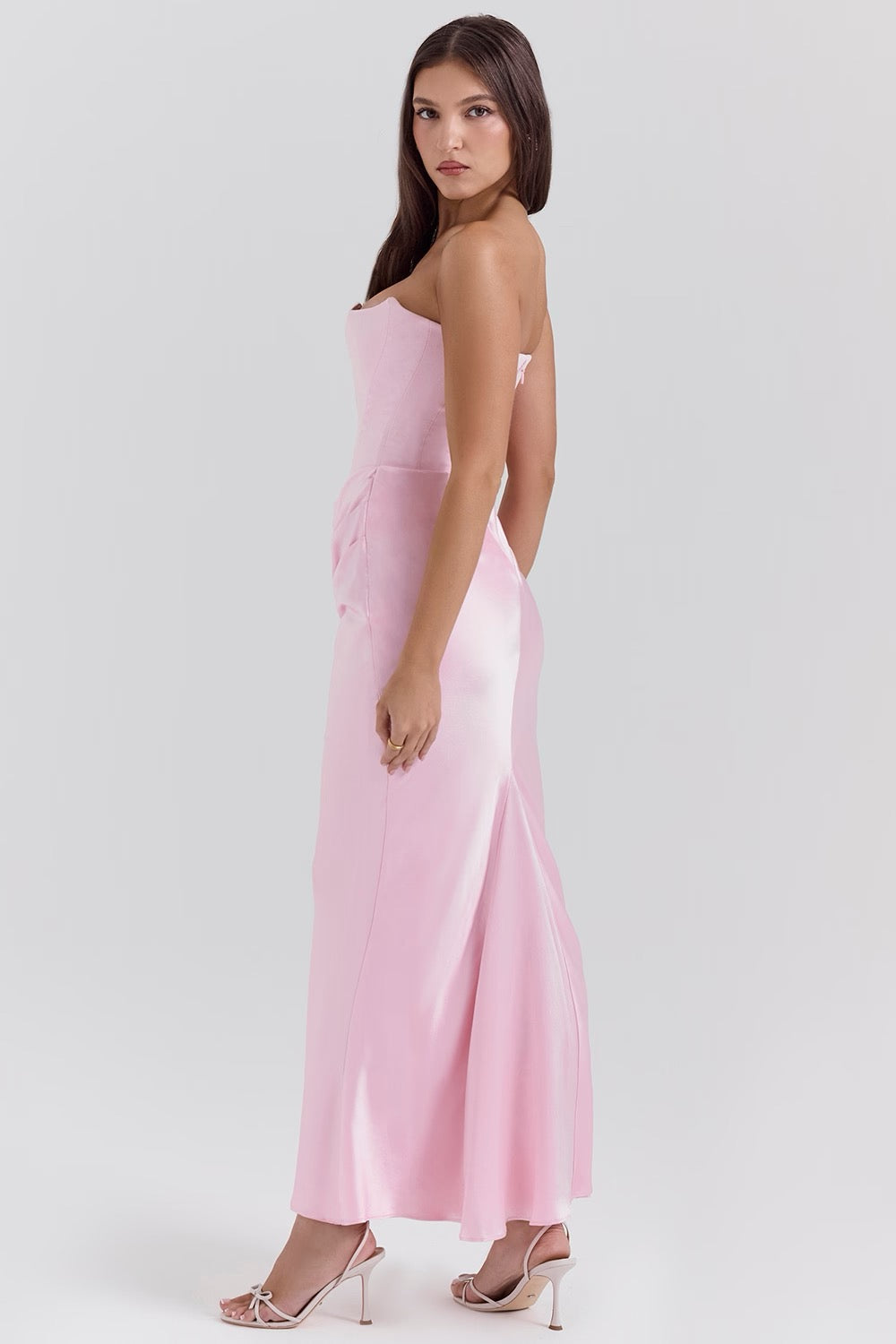 Stylish women's party dress, elegant strapless and draped design.