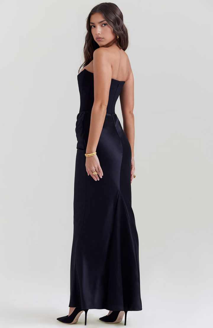 Formal women's strapless evening gown, perfect for wedding guests.