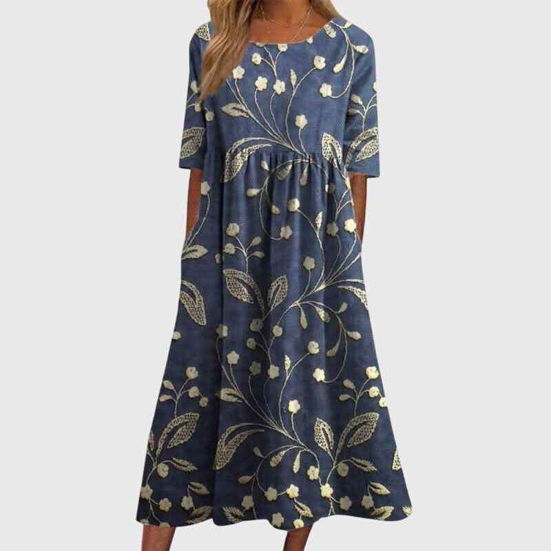 Elegant women's embroidered flowy midi dress, perfect for summer comfort and versatile occasions.